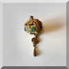 J07. Fillagree pendant with semi-precious stones. 